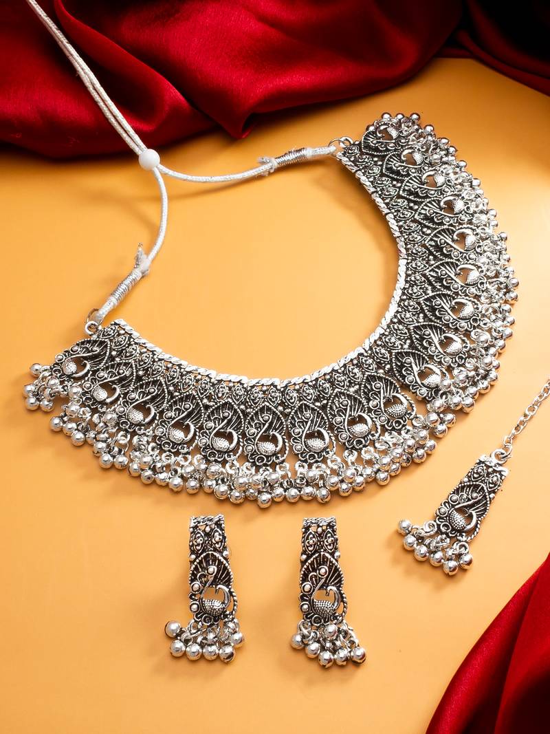oxidized silver peacock motif choker necklace set with ghungroo earrings and maang tikka
