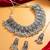 oxidized silver fan motif collar choker necklace set with ghungroo earrings and maang tikka