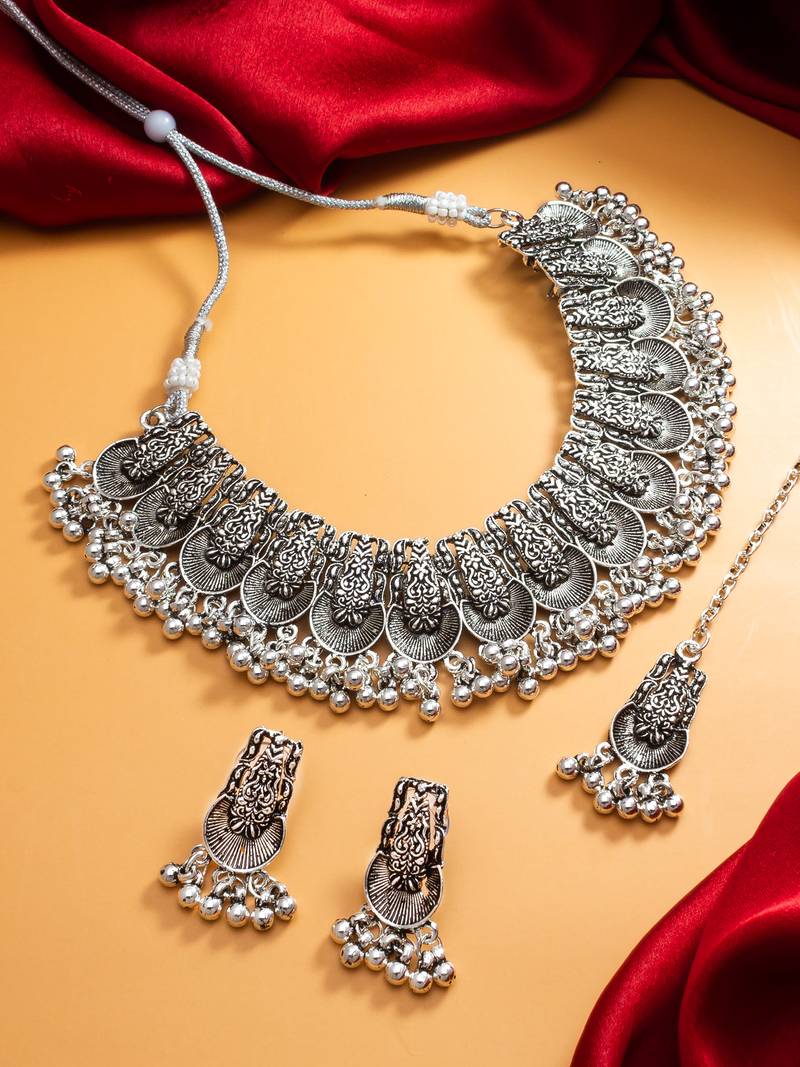 oxidized silver fan motif collar choker necklace set with ghungroo earrings and maang tikka