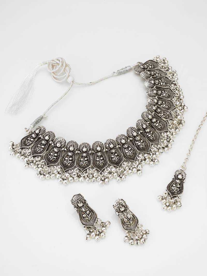 oxidized silver leaf motif choker necklace set with ghungroo drops, earrings and maang tikka