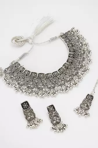 oxidized silver floral panel choker necklace set with ghungroo drops, earrings and maang tikka