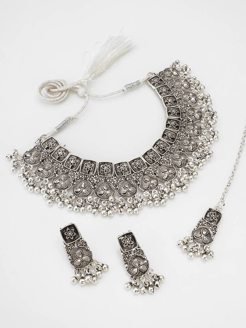 oxidized silver floral panel choker necklace set with ghungroo drops, earrings and maang tikka
