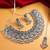 oxidized silver floral panel choker necklace set with ghungroo drops, earrings and maang tikka