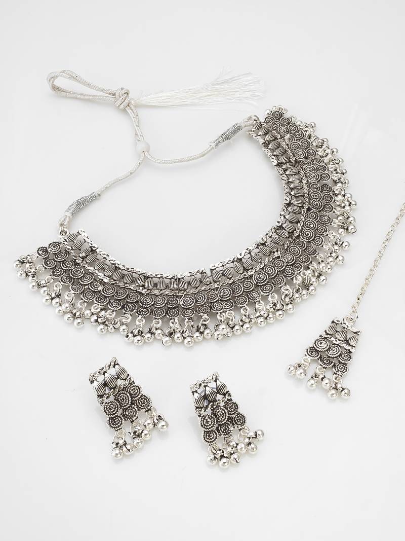 navratri special oxidized silver motif choker necklace set with ghungroo fringe, earrings and maang tikka