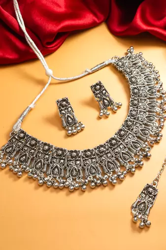 navratri special oxidized silver broad choker necklace set with ghungroo fringe, earrings and maang tikka