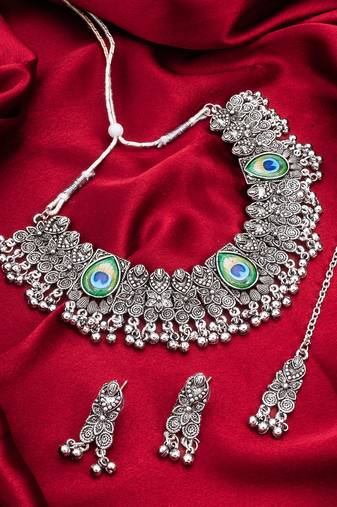 oxidized silver choker necklace set with peacock feather, ghungroo drops, earrings and maang tikka