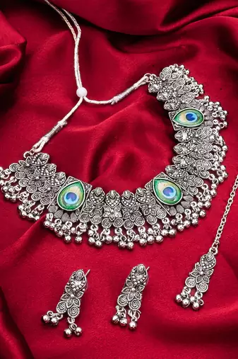 oxidized silver choker necklace set with peacock feather, ghungroo drops, earrings and maang tikka