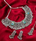 oxidized silver floral choker necklace set with ghungroo drops, earrings and maang tikka