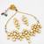 gold toned heavy kundan set