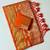 orange tassels on pallu with flower georgette saree