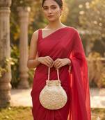 Elegant cream peach pearl embroidered potli bag with beaded handle