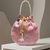 Elegant light pink peach pearl embroidered potli bag with beaded handle