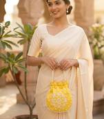 Elegant yellow peach pearl embroidered potli bag with beaded handle