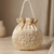 Elegant cream peach pearl embroidered potli bag with beaded handle