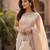 Elegant beige embroidered potli bag with beaded handle