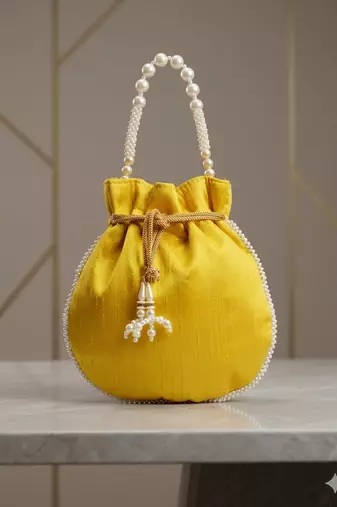 Elegant yellow peach pearl embroidered potli bag with beaded handle