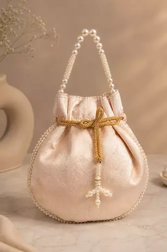 Elegant beige embroidered potli bag with beaded handle