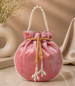 Elegant pastel pink pearl embroidered potli bag with beaded handle