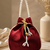 Luxury maroon pearl embroidered potli bag with beaded handle – bridal & festive clutch