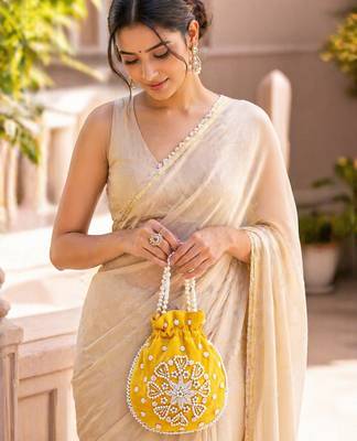 Elegant yellow pearl embroidered potli bag with beaded handle 1