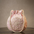 Elegant pink pearl embroidered potli bag with beaded handle