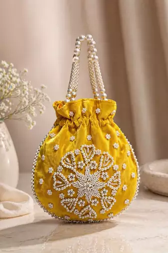Elegant yellow pearl embroidered potli bag with beaded handle