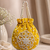 Elegant yellow pearl embroidered potli bag with beaded handle