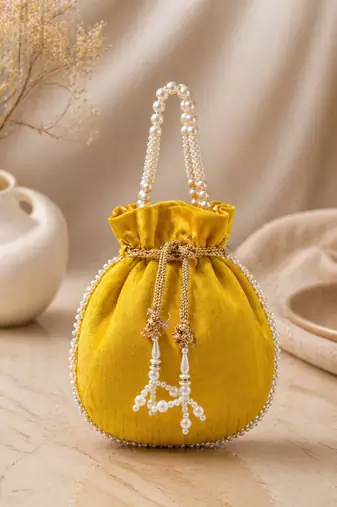 Elegant yellow pearl embroidered potli bag with beaded handle