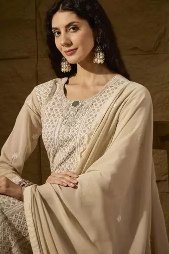 Cream faux georgette stitched gown with lace dupatta full sleeve embroidered