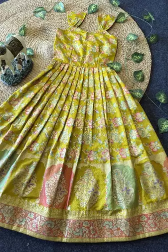 Festive wear yellow dola silk zari and thread weaving gown with pink koti