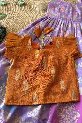Festive wear lavender dola silk zari and thread weaving gown with orange koti