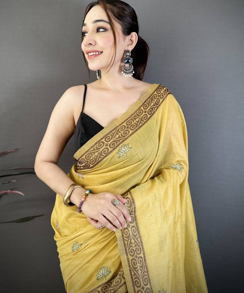 yellow printed cotton saree with unstitched blouse piece