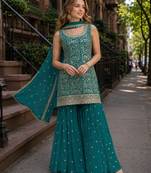 Teal green blooming georgette suit with heavy embroidery & sequin work