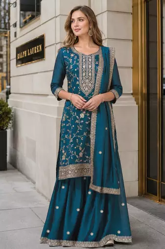 Teal vichitra suit with heavy embroidery work