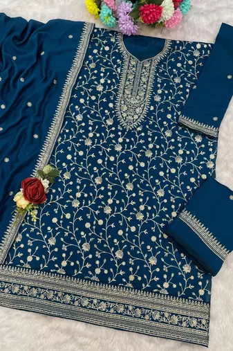 Teal vichitra suit with heavy embroidery work