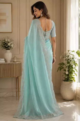 sky blue embroidered designer shimmer chiffon saree with scalloped border
