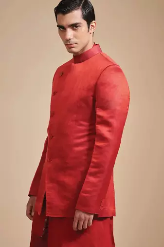 Coral red solid art art silk kurta churidar nehru jacket set for men