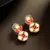 Red stone kundan drop earrings