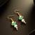 Green pearl kundan drop earrings