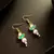 Green pearl kundan drop earrings