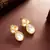 White teardrop statement earrings