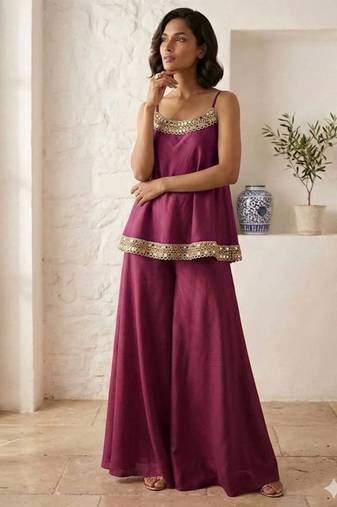 Plum palazzo set with mirror-work detailing.