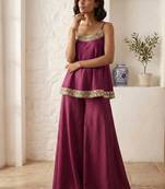 Plum palazzo set with mirror-work detailing.