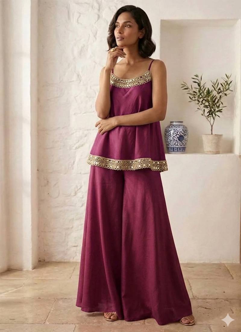 Plum palazzo set with mirror-work detailing.