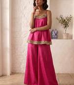 hot pink palazzo set with mirror-work detailing.