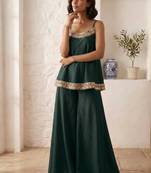 dark green palazzo set with mirror-work detailing.
