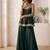 dark green palazzo set with mirror-work detailing.
