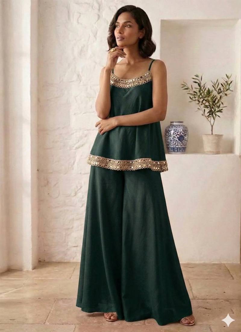 dark green palazzo set with mirror-work detailing.