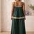 dark green palazzo set with mirror-work detailing.