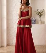 Red palazzo set with mirror-work detailing.